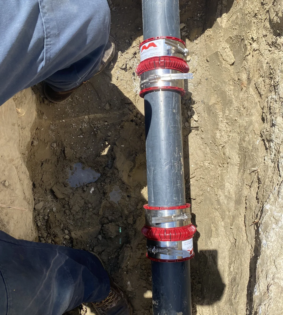Emergency repair clamps on a leaking underground water line