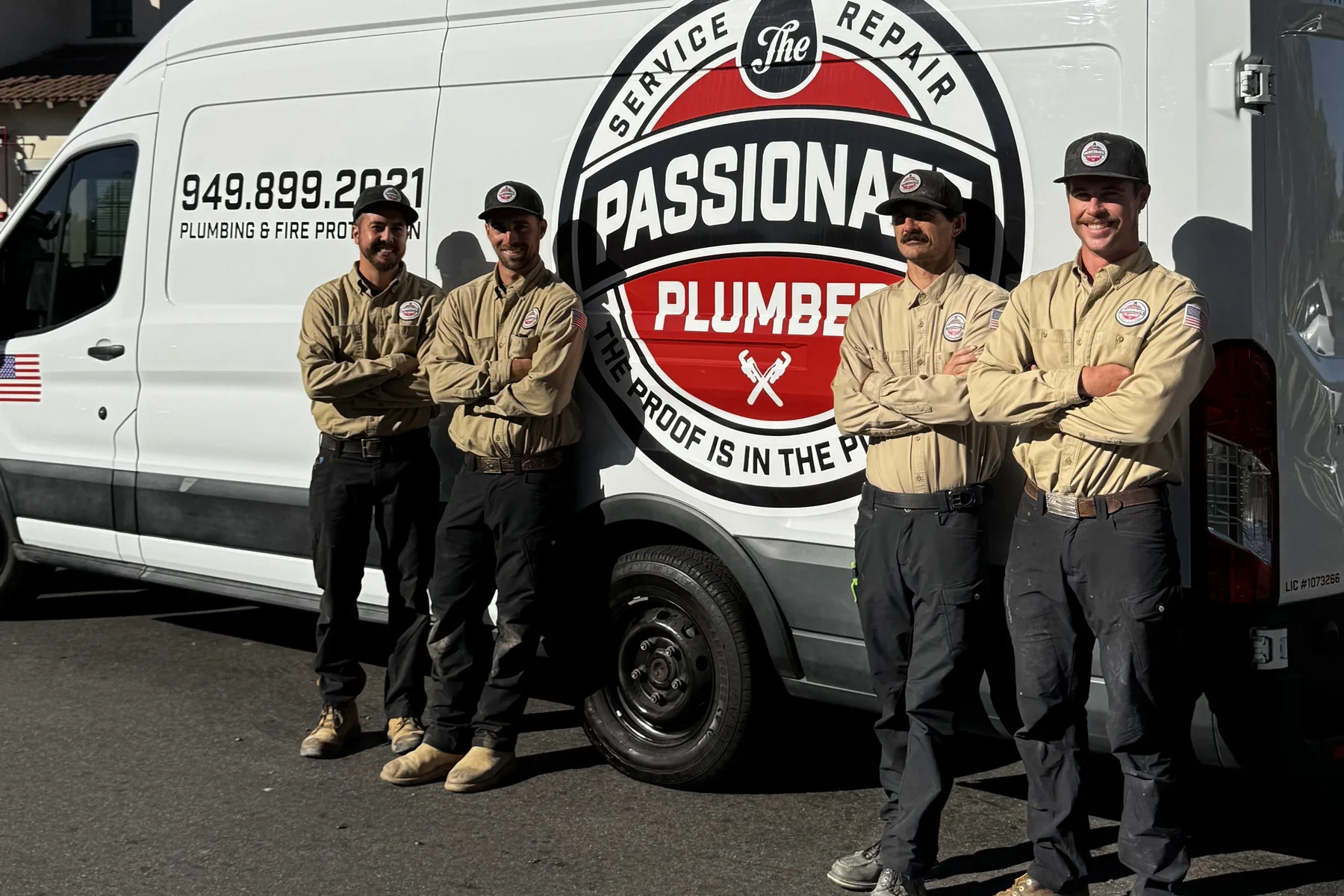 The Passionate Plumber team standing in front of their service van