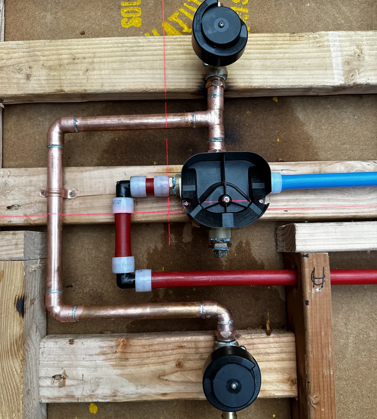 Repaired copper and PEX water lines with new shut-off valves inside a wall
