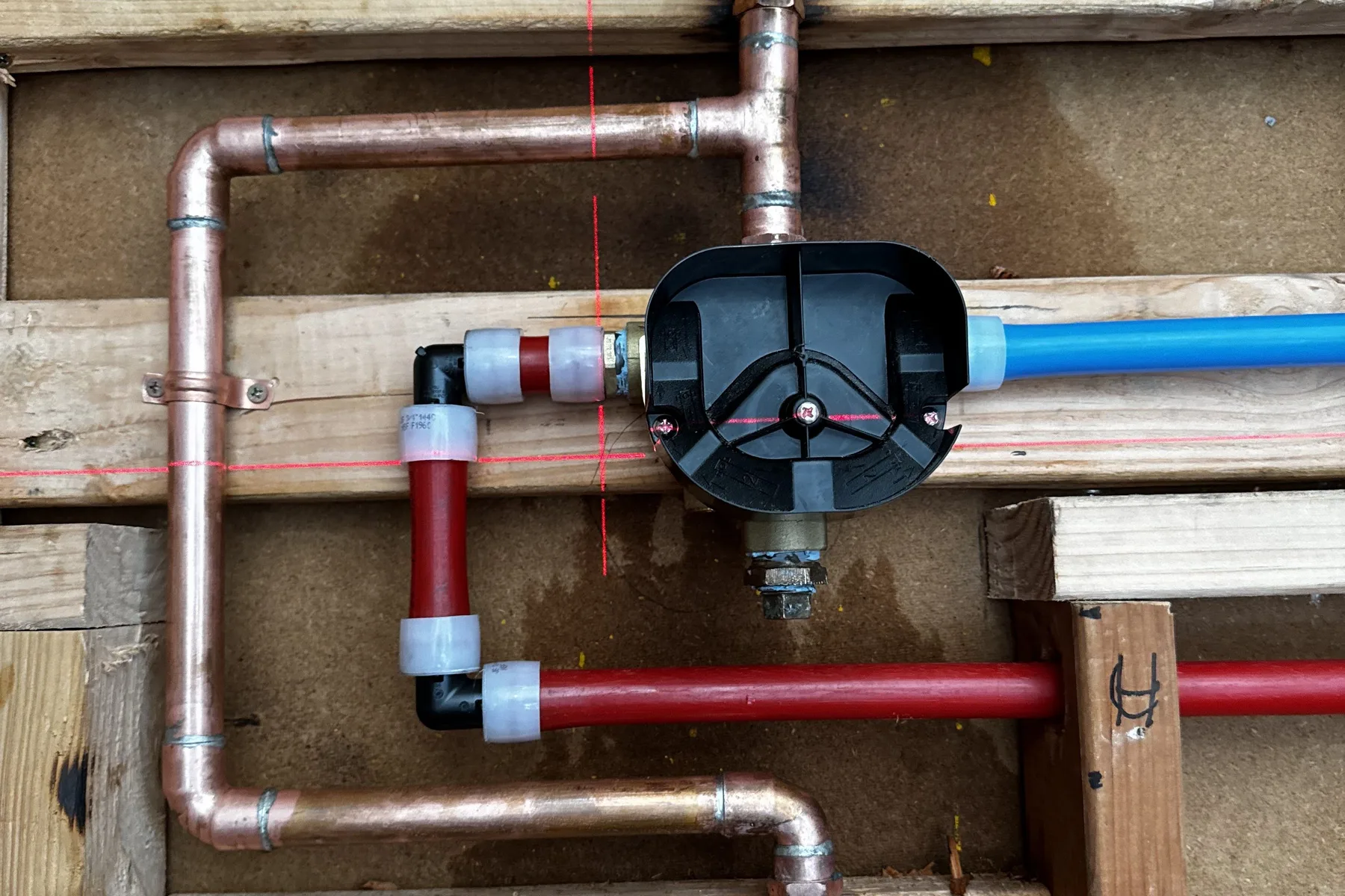 Repaired copper and PEX water lines with new shut-off valves inside a wall