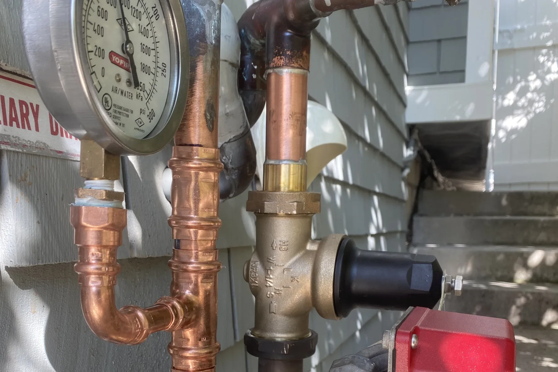 Pressure test gauge on a copper water line during leak detection