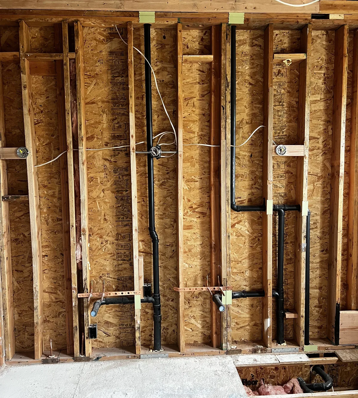 New plumbing rough-in for a remodel inside open wall framing