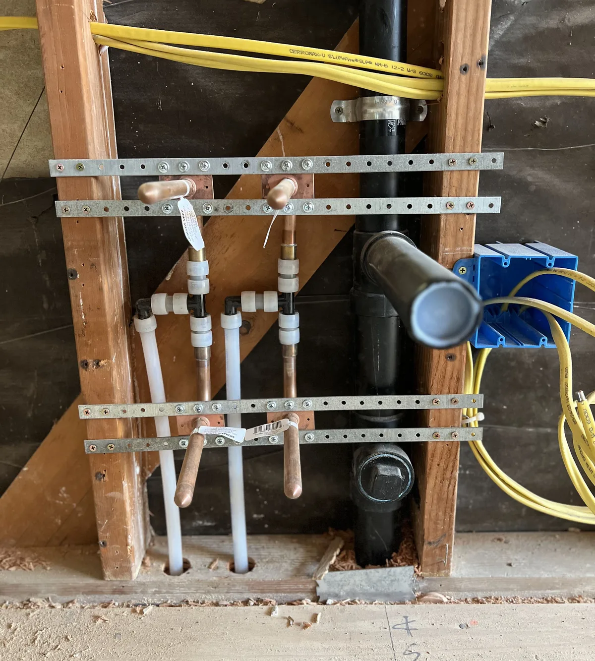 New PEX repipe supply lines and drain installed in open wall framing