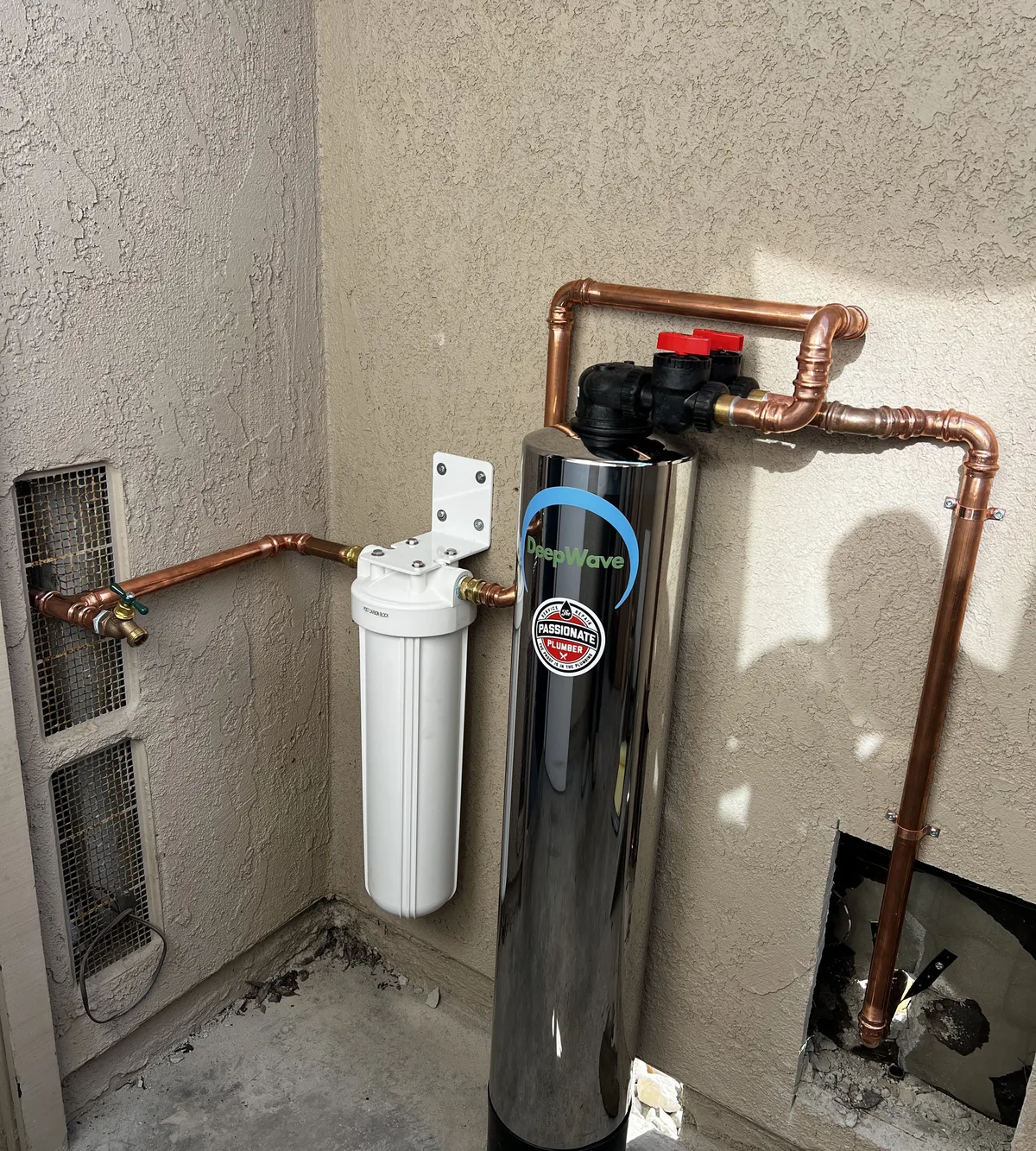 Whole-house water filtration system installed with copper piping