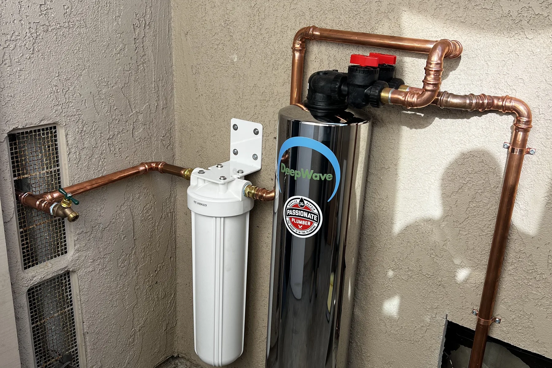 Whole-house water filtration system installed with copper piping